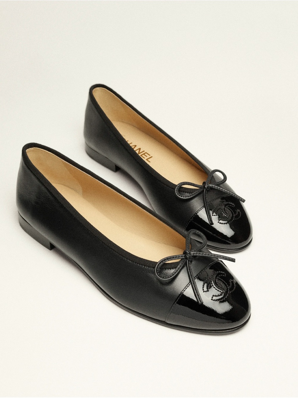 CHANEL Black Leather Cap-Toe Bow Ballet Flats